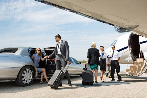 Reason why people love limos - a couple arriving at the airport using limo service.