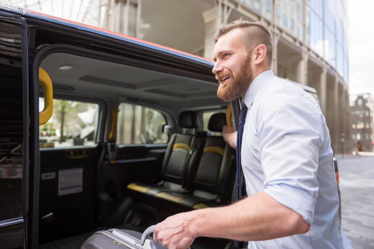 Man entering a sprinter van. 