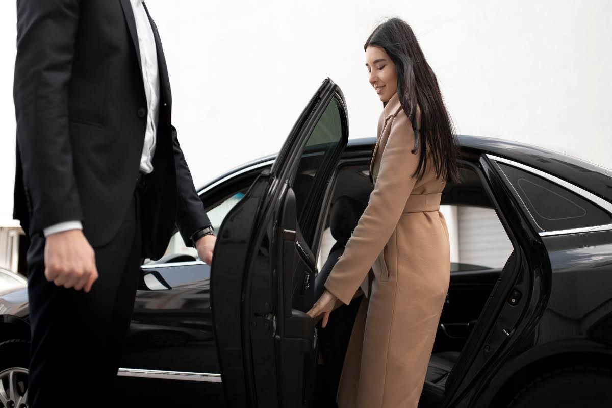 A Woman getting into a limo.
