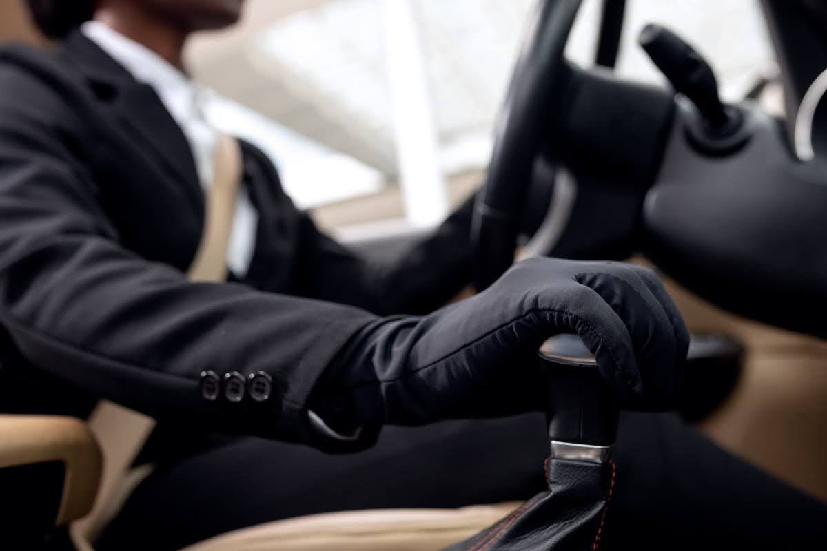 Professional chauffeur driving a limo for prom night.