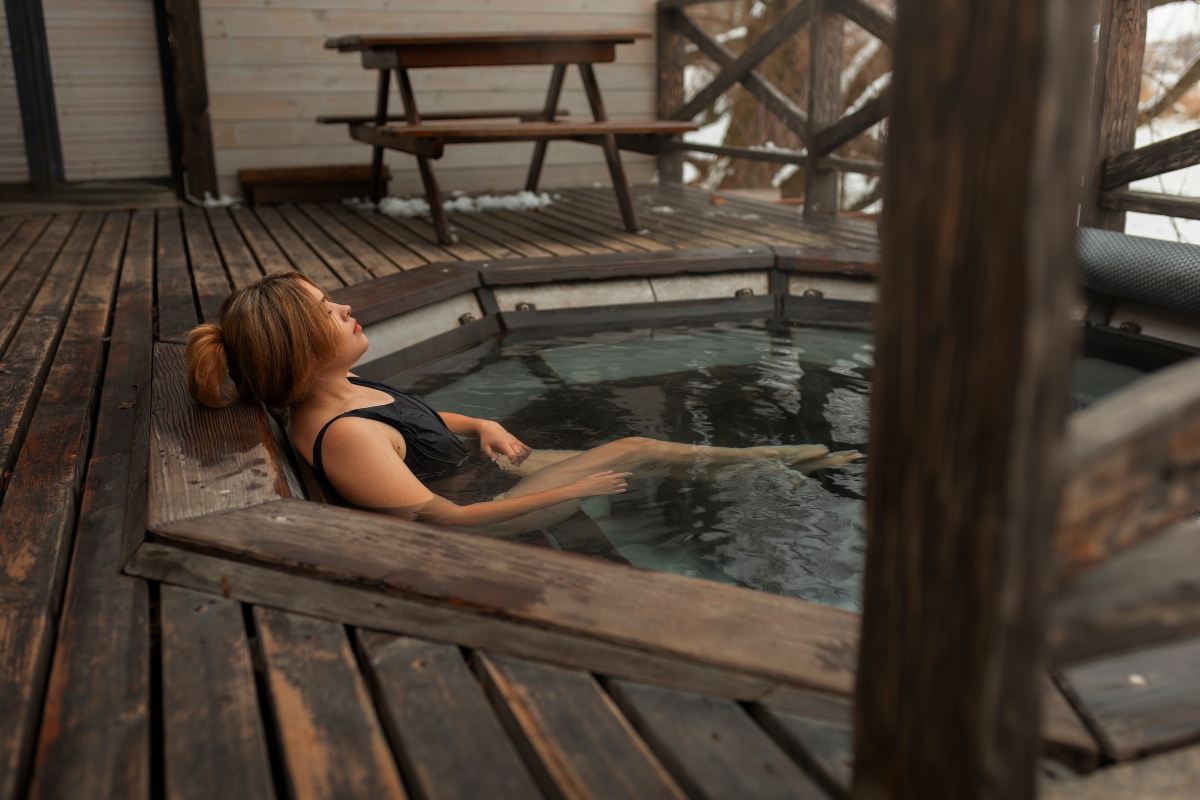 Woman enjoying a hot tub.